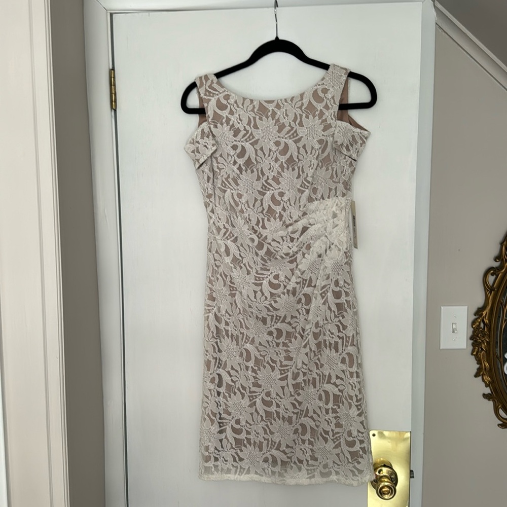 Eliza J dress new with tags. White lace with beige lining. Size 6.